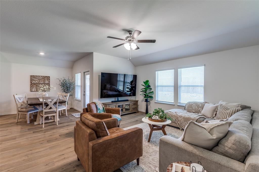 708 Cool Cyn Trail Princeton, TX 75407 - Photo 4 of 28 a living room with furniture flat screen tv and wooden floor
