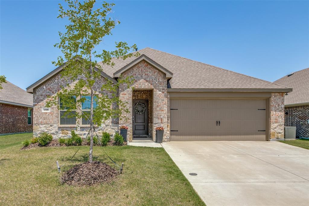 708 Cool Cyn Trail Princeton, TX 75407 - Photo 7 of 28 a front view of a house with garden