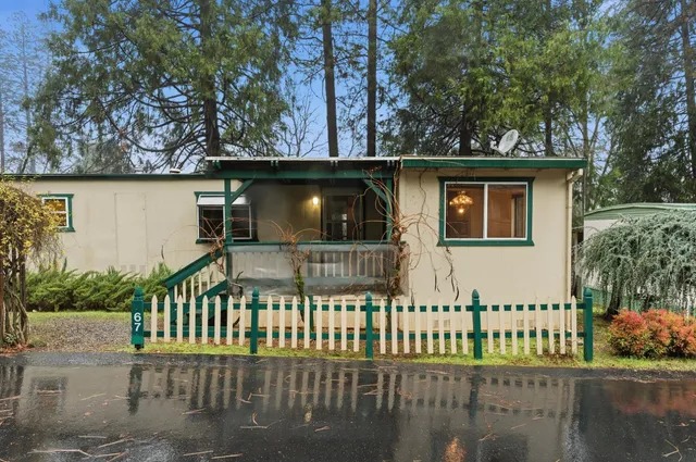 a view of a house with a small yard