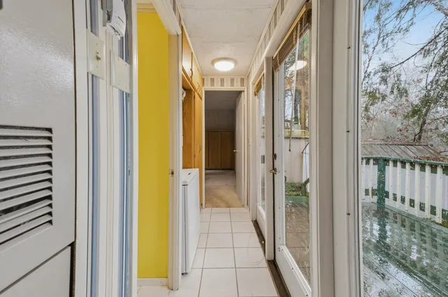 a view of a bathroom from a hallway
