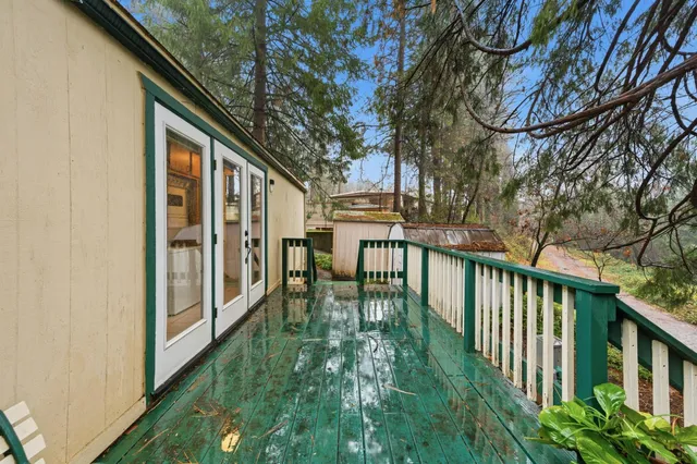 a balcony with lots of green space and plants