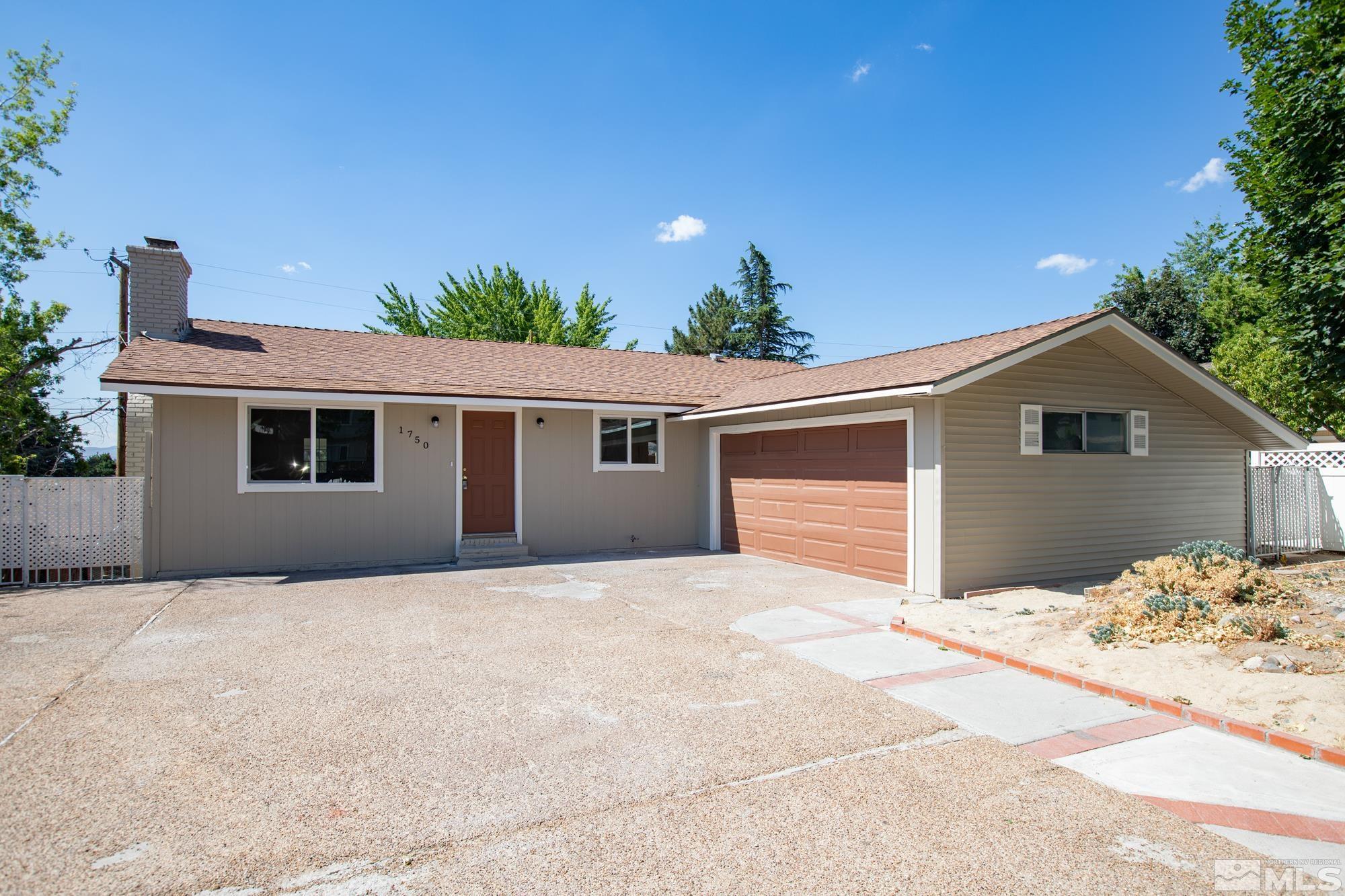 1750 Carlin Street Reno, NV 89503 - Photo 1 of 38 a house with trees in the background