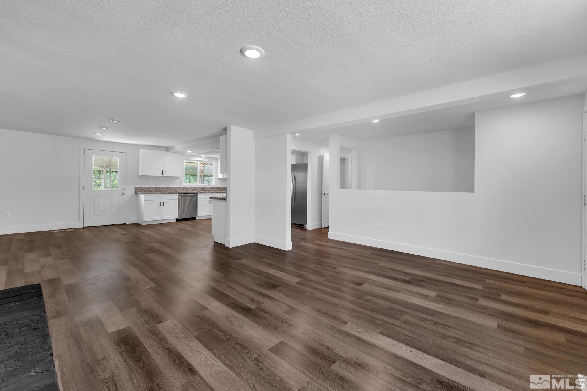 1750 Carlin Street Reno, NV 89503 - Photo 2 of 38 a view of a kitchen with a sink and a refrigerator