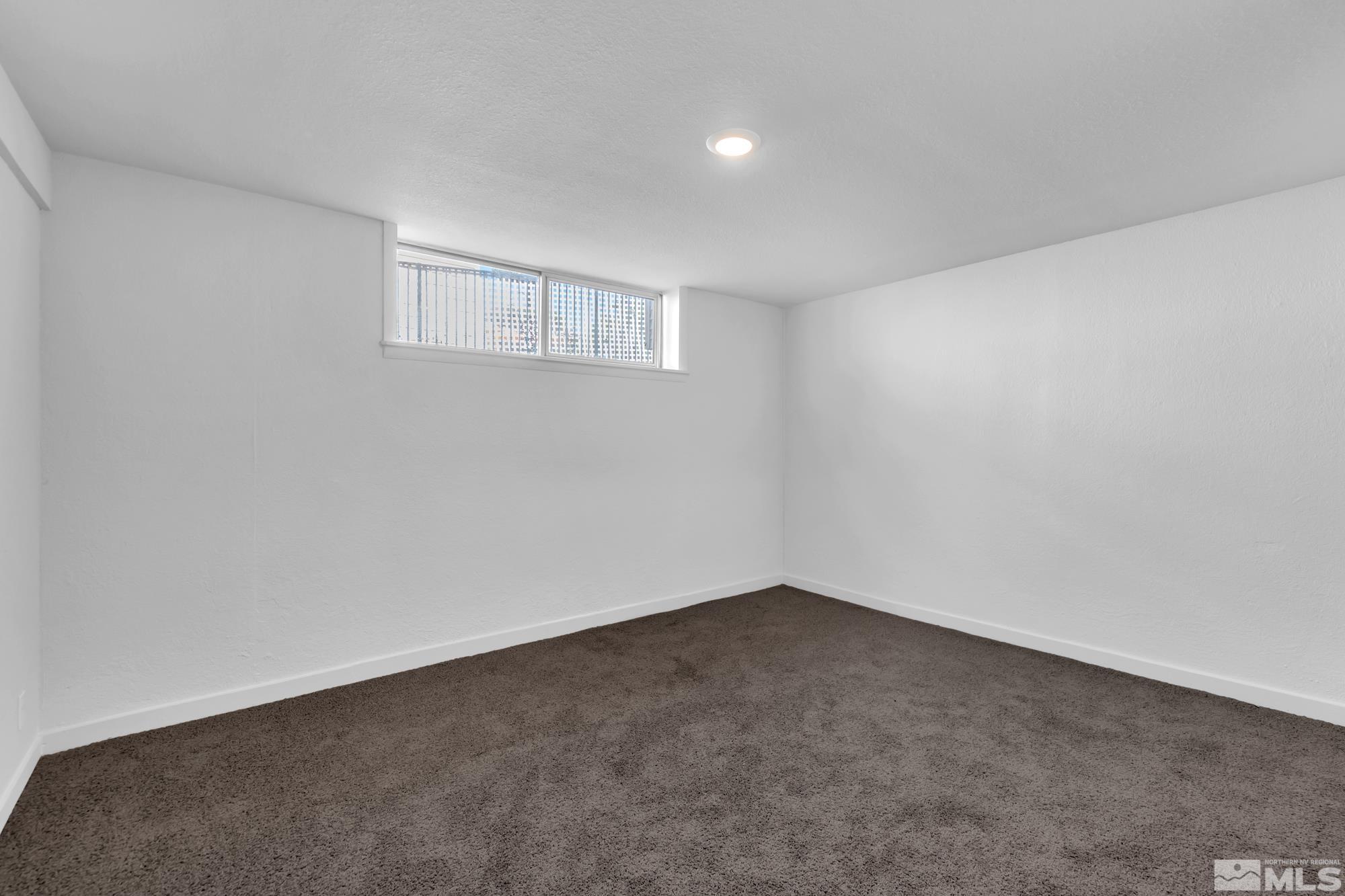 1750 Carlin Street Reno, NV 89503 - Photo 23 of 38 a view of an empty room with a window