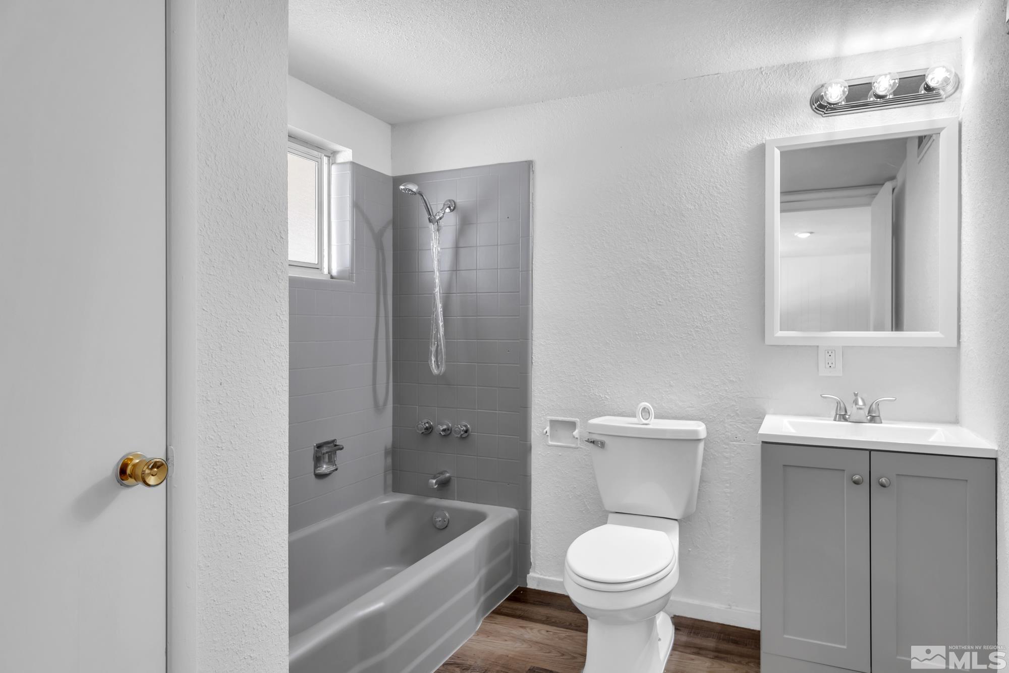 1750 Carlin Street Reno, NV 89503 - Photo 24 of 38 a bathroom with a sink toilet and shower
