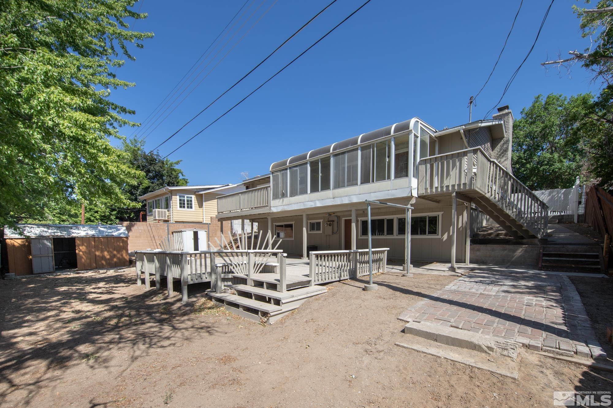 1750 Carlin Street Reno, NV 89503 - Photo 31 of 38 a front view of a house with yard and sitting area