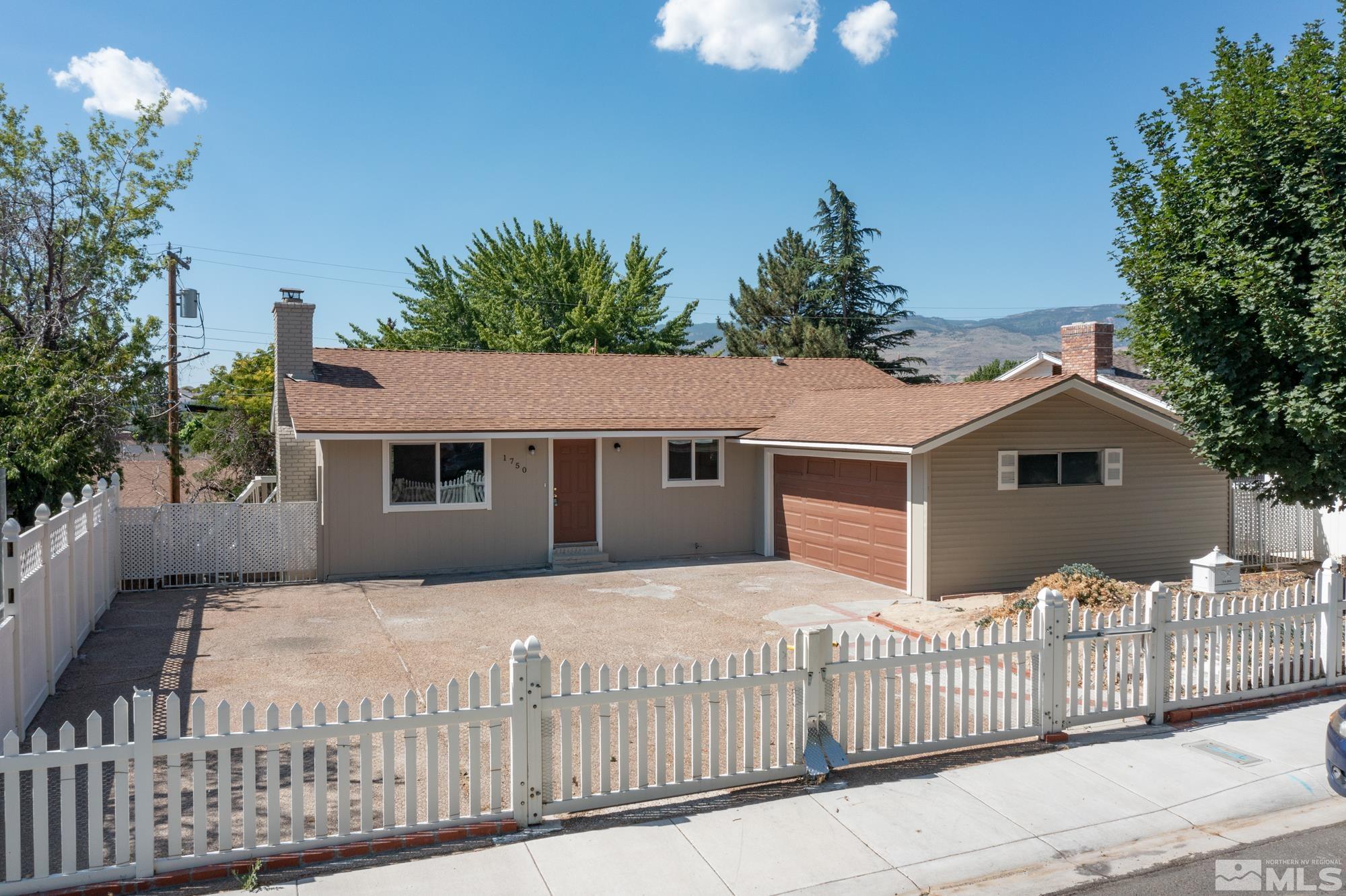 1750 Carlin Street Reno, NV 89503 - Photo 35 of 38 a front view of a house with a yard