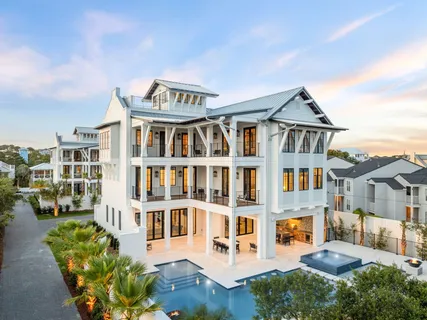 a front view of a residential apartment building with a yard