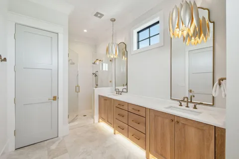 a bathroom with a double vanity sink and a mirror