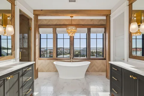 a spacious bathroom with a bathtub and a sink