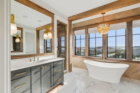 a spacious bathroom with a tub and sink
