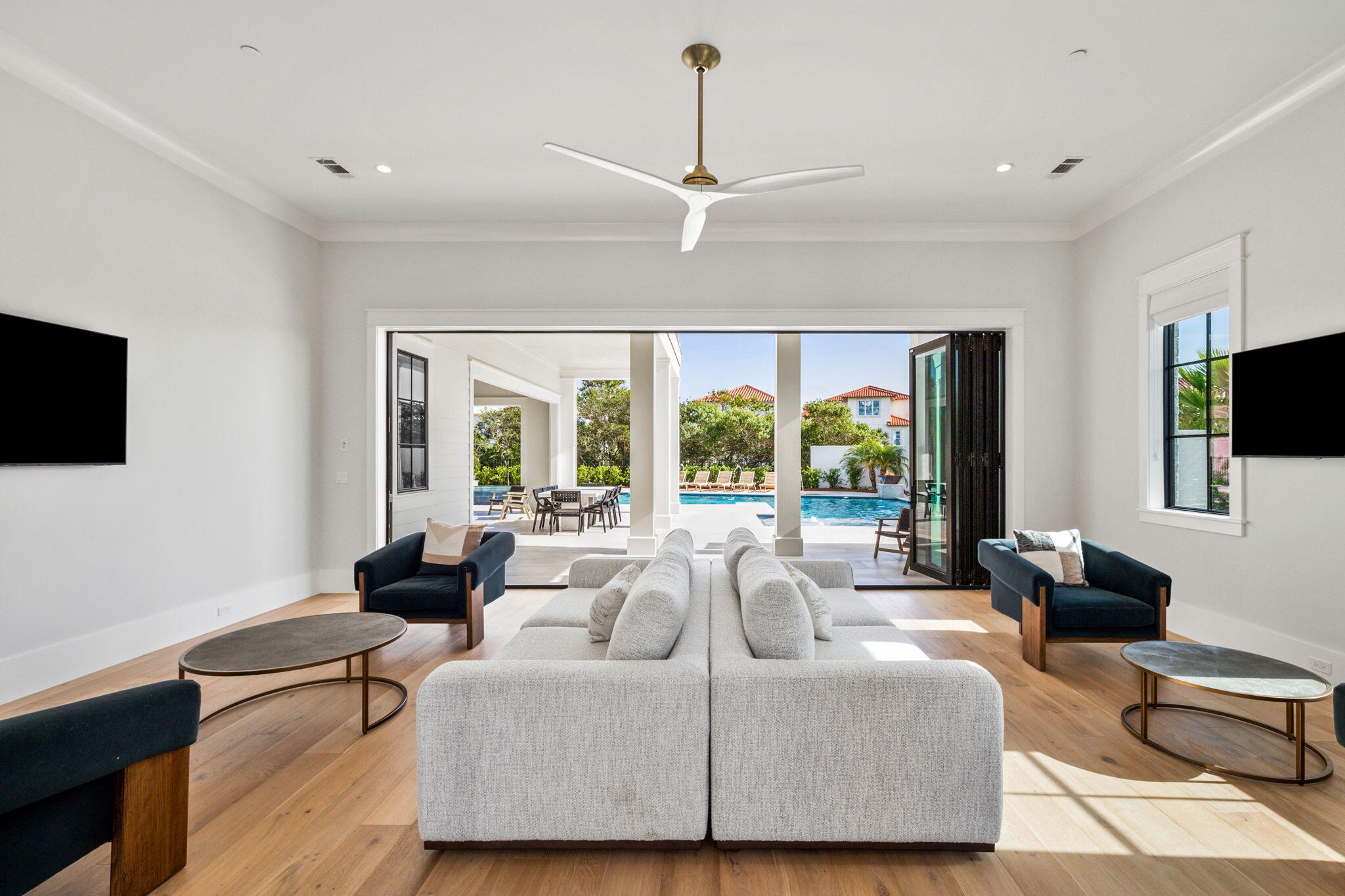 5012 West County Highway 30A Santa Rosa Beach, FL 32459 - Photo 5 of 27 a living room with furniture and a flat screen tv