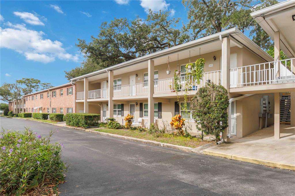 2500 Lee Road, Unit 244 Winter Park, FL 32789 - Photo 2 of 26 a front view of a house with garden