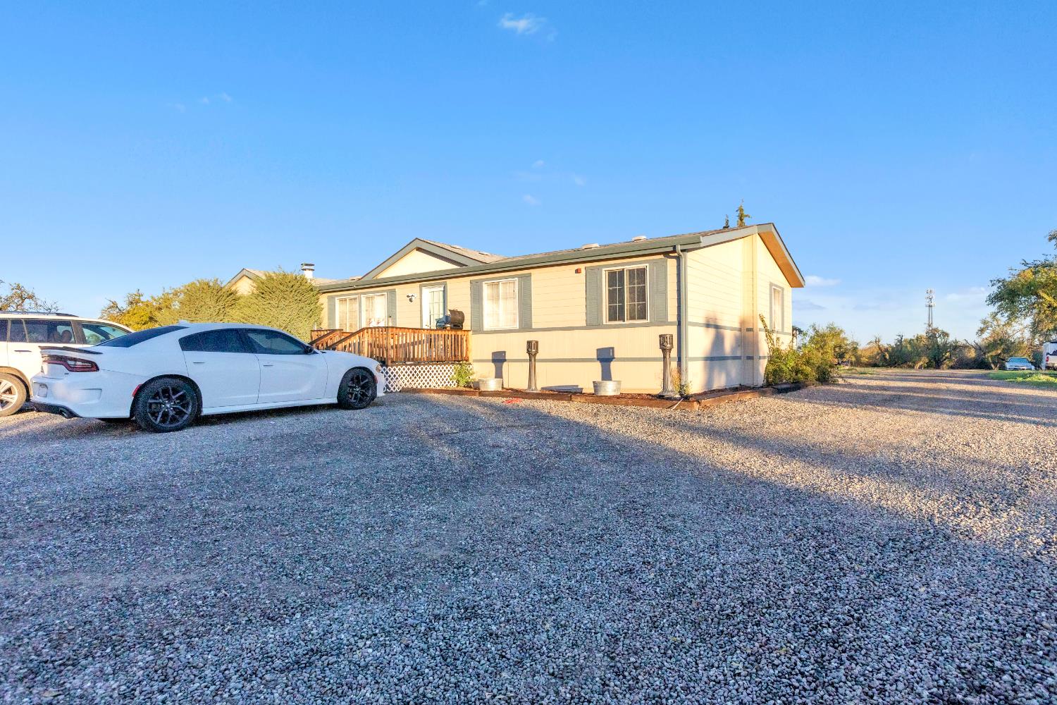 25752 State Highway Esparto, CA 95627 - Photo 12 of 60 a car parked in front of a house next to a yard