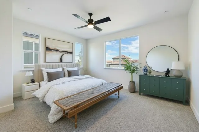 a en suite bathroom with double sink and a mirror