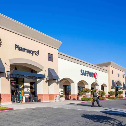 a view of a swimming pool with a table and chairs