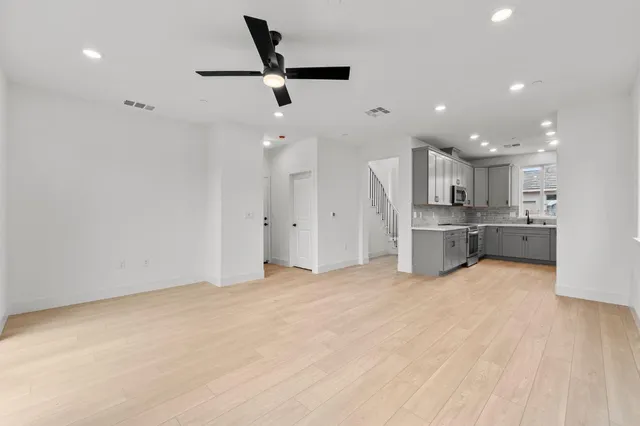 a bathroom with a sink mirror and toilet