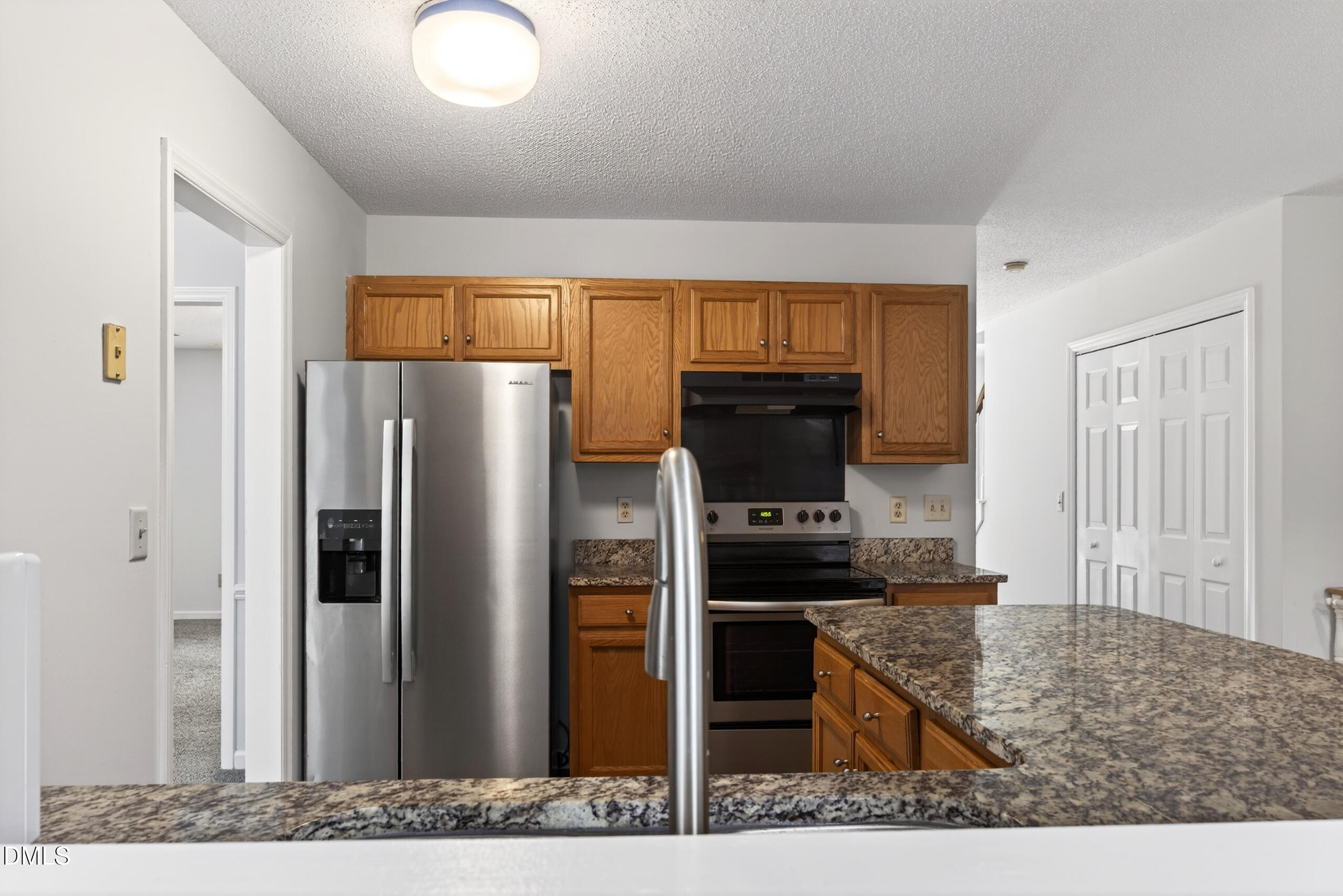 1901 Whites Mill Road High Point, NC 27265 - Photo 10 of 24 a kitchen with stainless steel appliances kitchen island granite countertop a refrigerator stove and oven