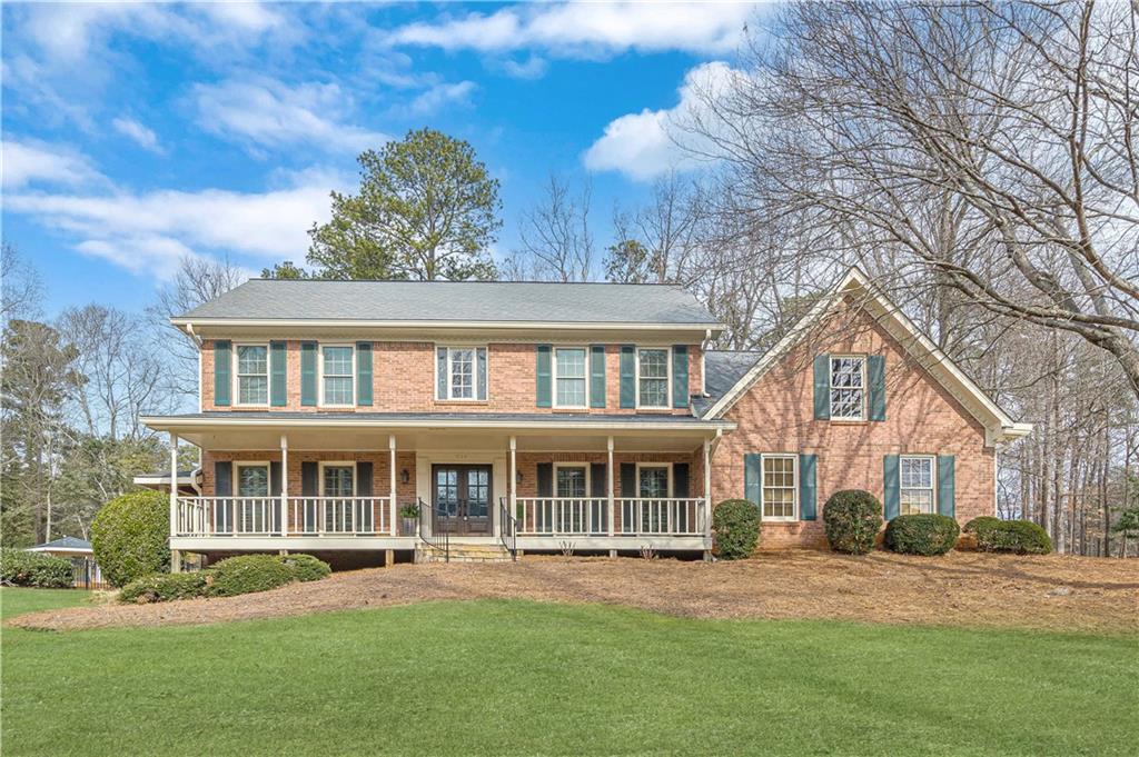 front view of a house with a yard