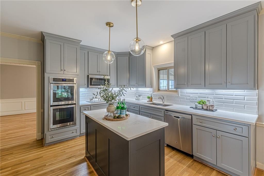 420 Junction Track Roswell, GA 30075 - Photo 13 of 45 a kitchen with a sink stove and microwave