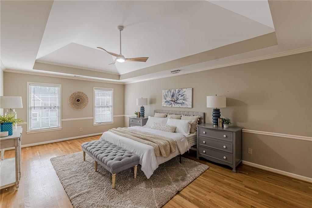 420 Junction Track Roswell, GA 30075 - Photo 22 of 45 a bedroom with a bed and wooden floor