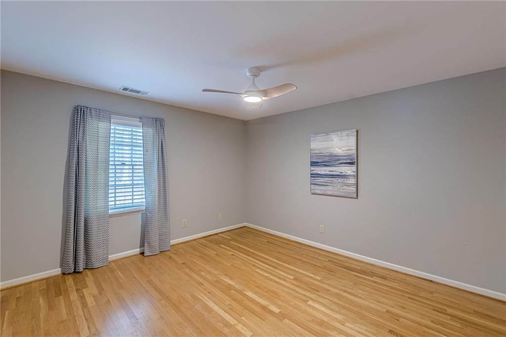 420 Junction Track Roswell, GA 30075 - Photo 26 of 45 a view of empty room with wooden floor and fan