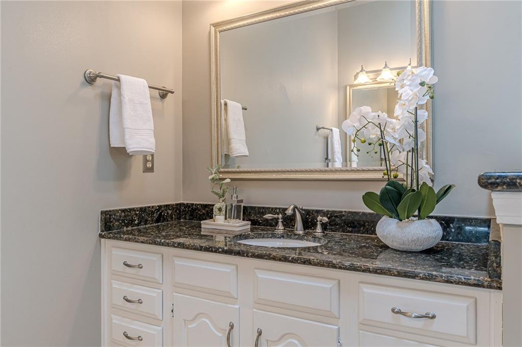 420 Junction Track Roswell, GA 30075 - Photo 29 of 45 a bathroom with sink and mirror