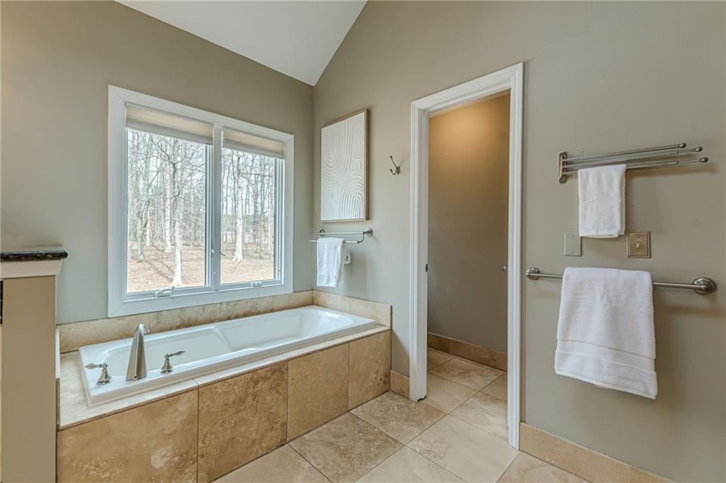 420 Junction Track Roswell, GA 30075 - Photo 30 of 45 a spacious bathroom with a tub shower and sink