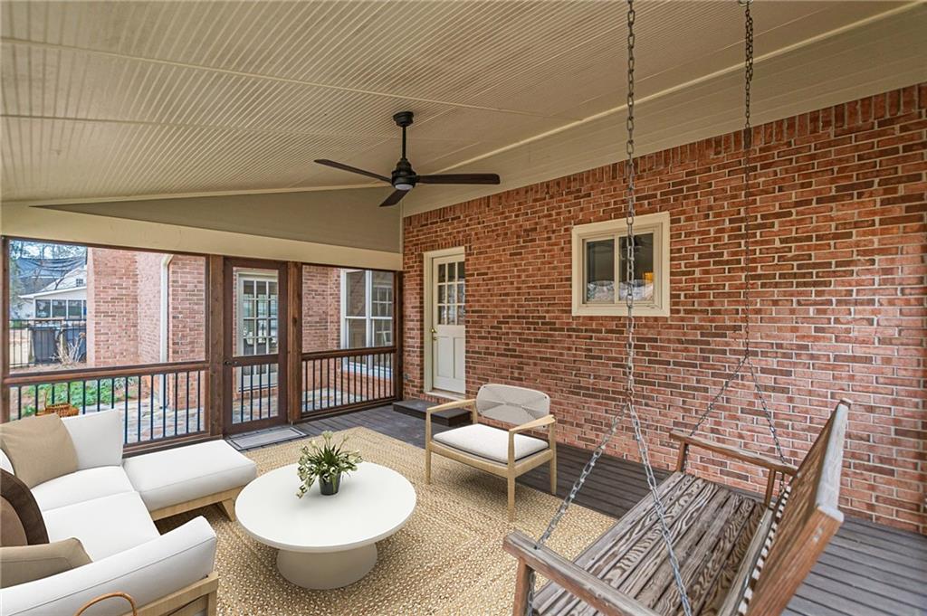 420 Junction Track Roswell, GA 30075 - Photo 35 of 45 a living room with furniture and a table with wooden floor