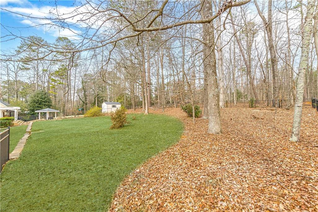 420 Junction Track Roswell, GA 30075 - Photo 37 of 45 a garden with trees in front of it