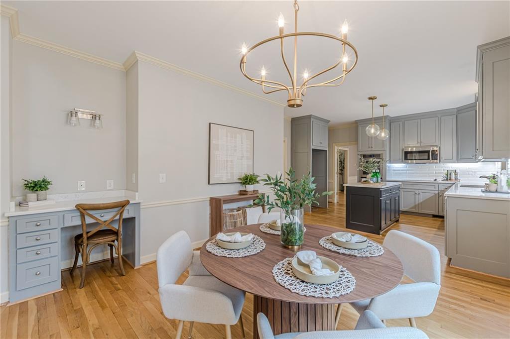 420 Junction Track Roswell, GA 30075 - Photo 10 of 45 a view of a dining room with furniture a kitchen and chandelier