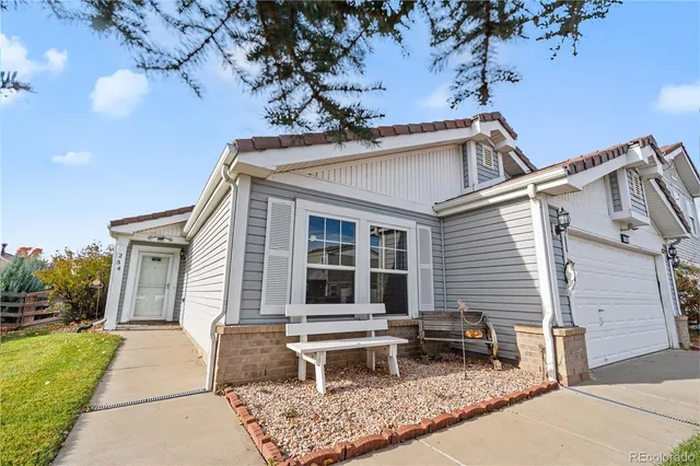 a backyard of a house with garden and patio