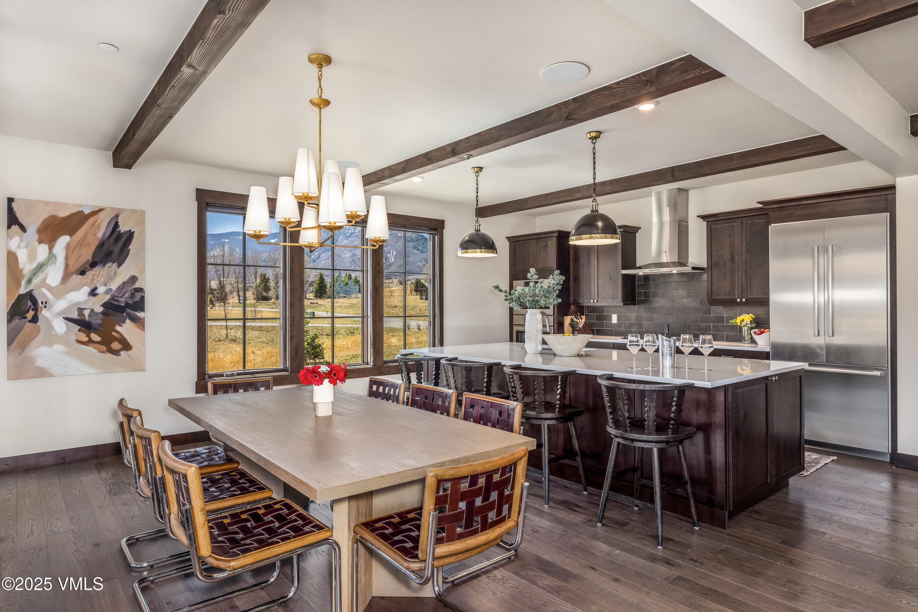 687 Hunters View Lane Eagle, CO 81631 - Photo 11 of 43 a dining table with chairs and window