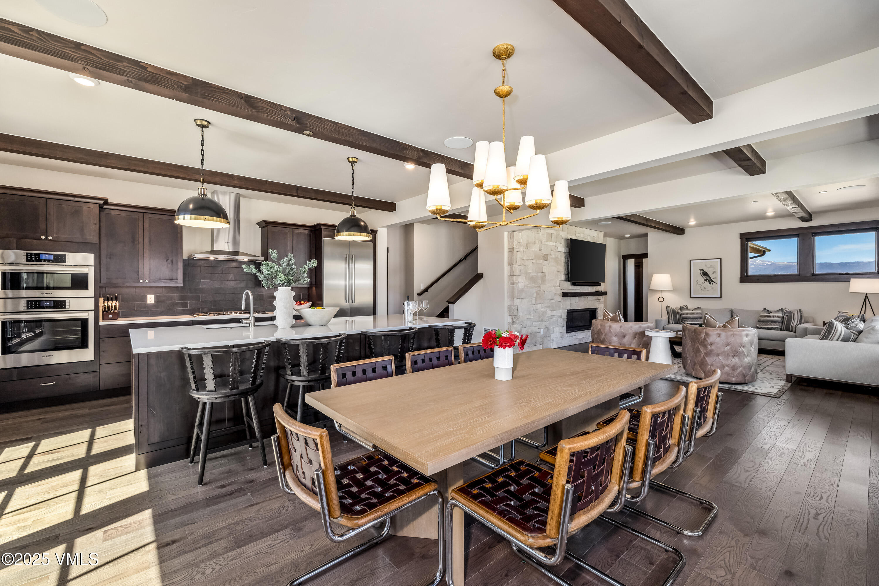 687 Hunters View Lane Eagle, CO 81631 - Photo 12 of 43 a view of a dining room with furniture and wooden floor