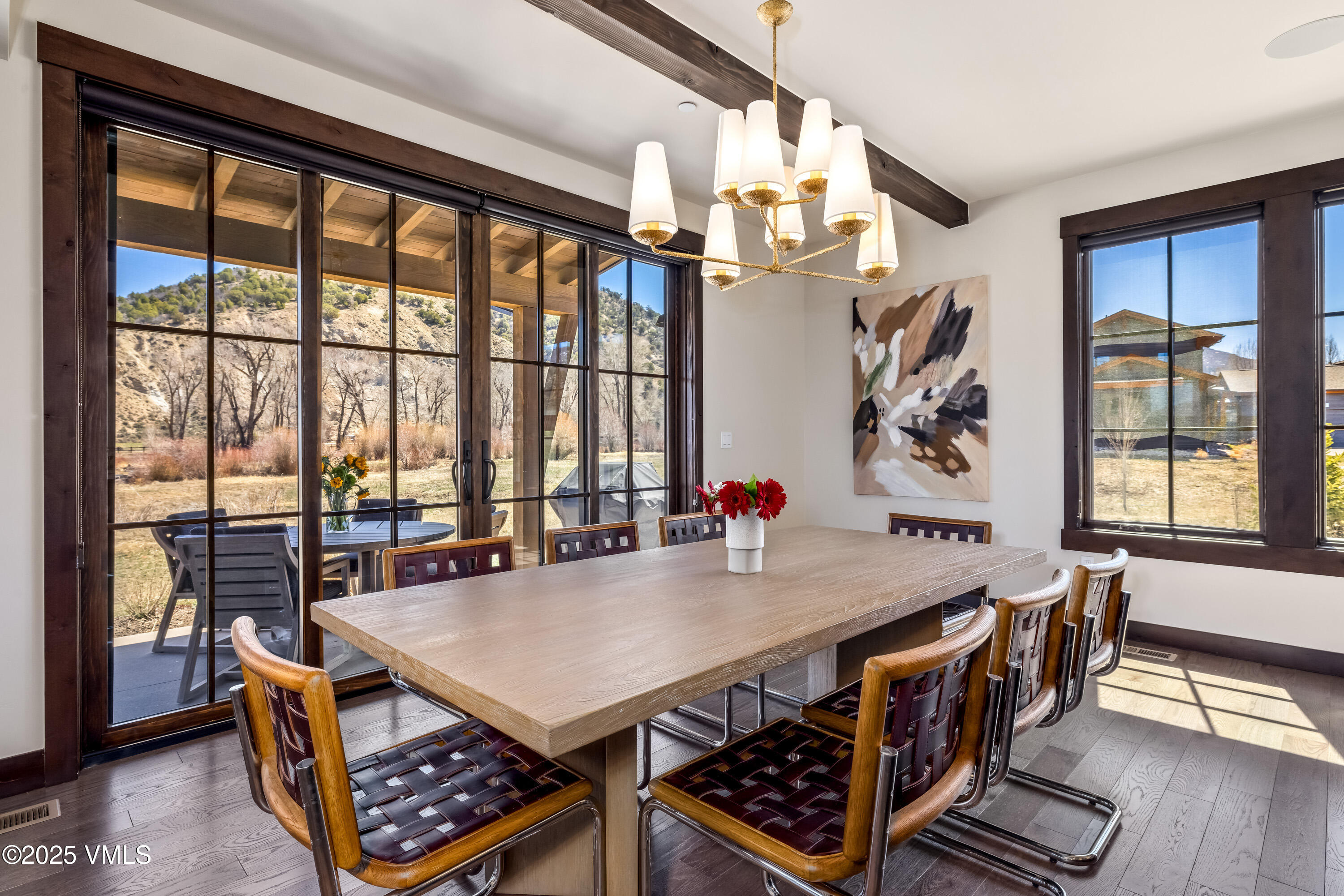 687 Hunters View Lane Eagle, CO 81631 - Photo 13 of 43 a view of a dining room with furniture window and wooden floor