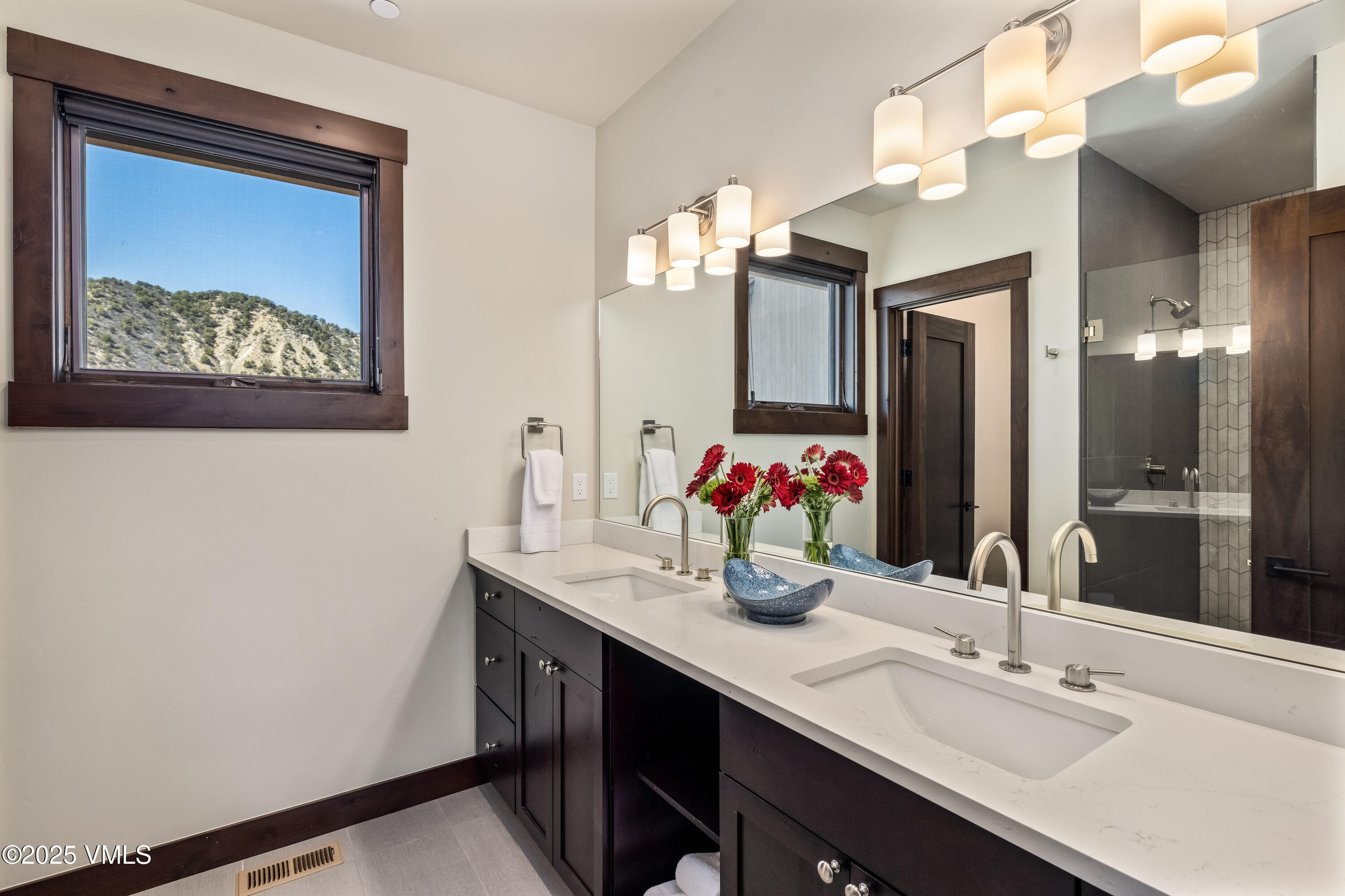 687 Hunters View Lane Eagle, CO 81631 - Photo 16 of 43 a bathroom with a sink and a mirror