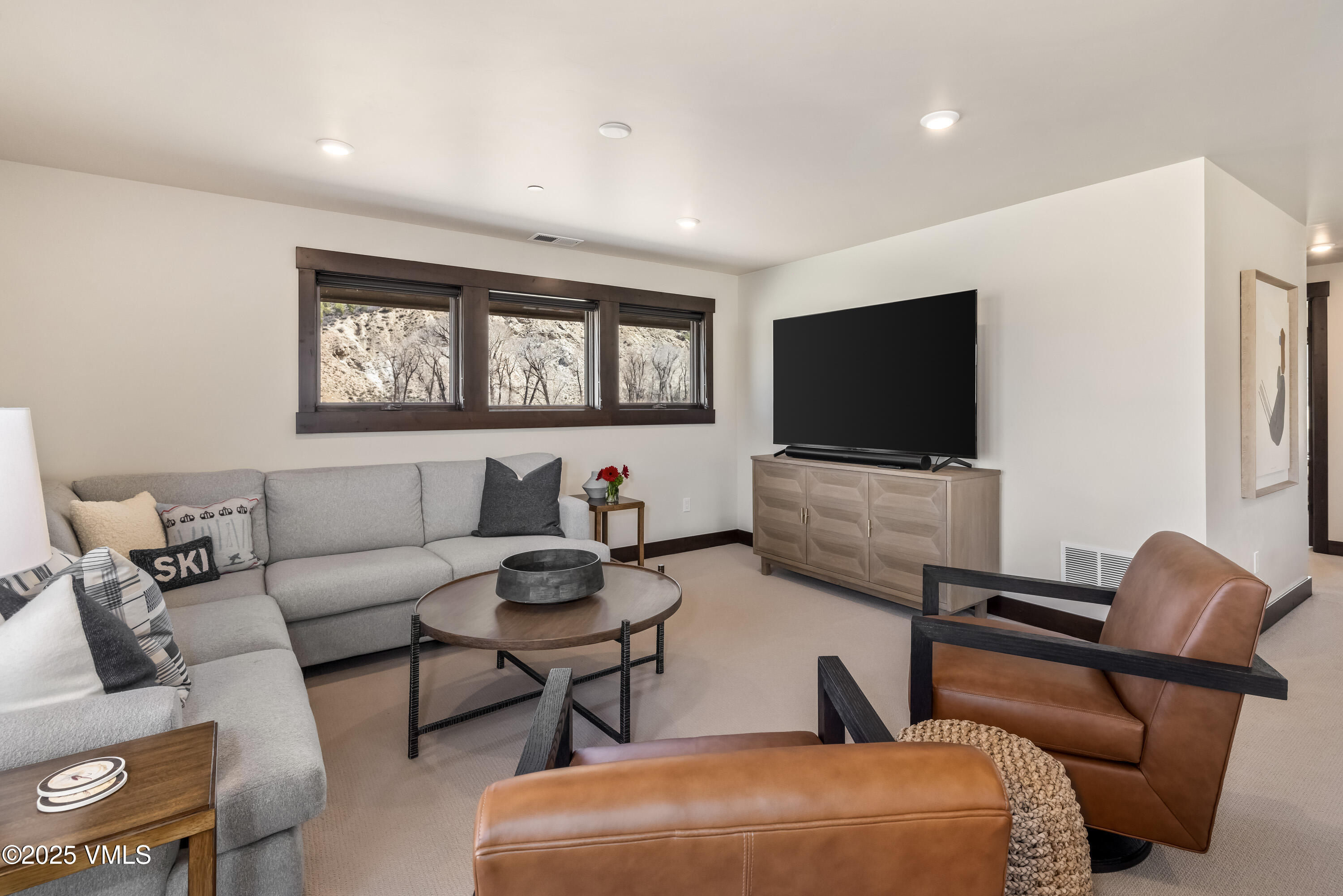 687 Hunters View Lane Eagle, CO 81631 - Photo 17 of 43 a living room with furniture and a flat screen tv