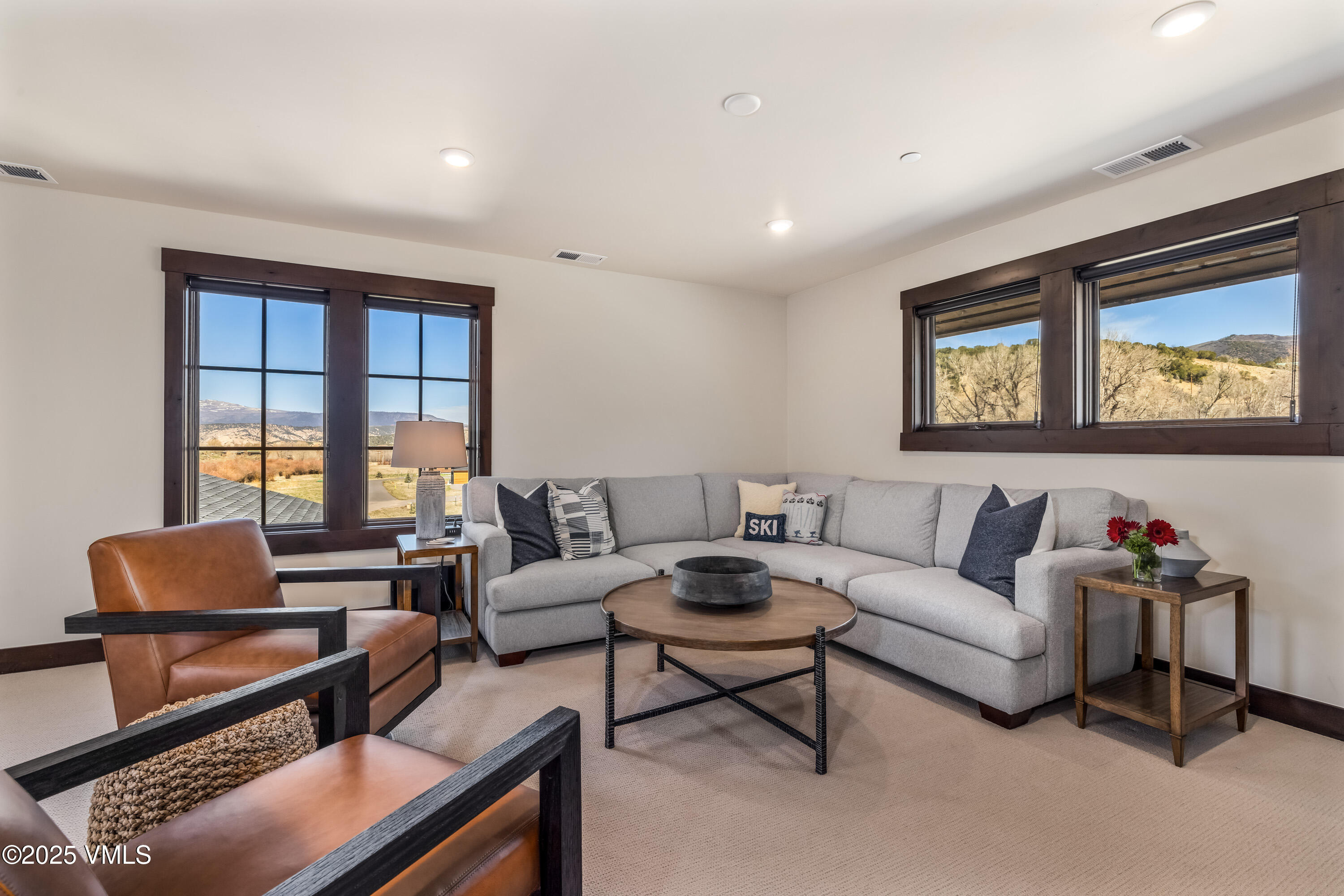 687 Hunters View Lane Eagle, CO 81631 - Photo 18 of 43 a living room with furniture and a large window
