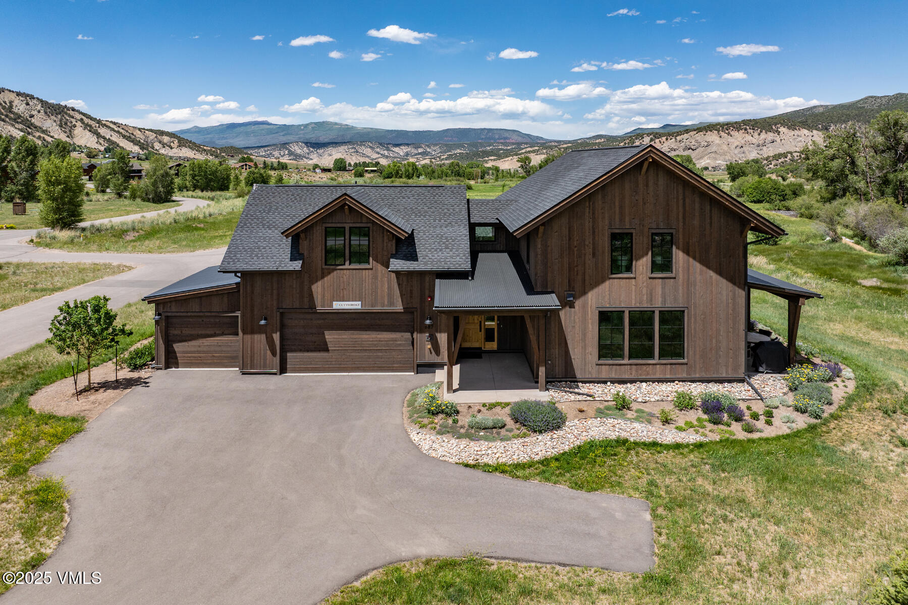 687 Hunters View Lane Eagle, CO 81631 - Photo 2 of 43 a front view of a house with garden