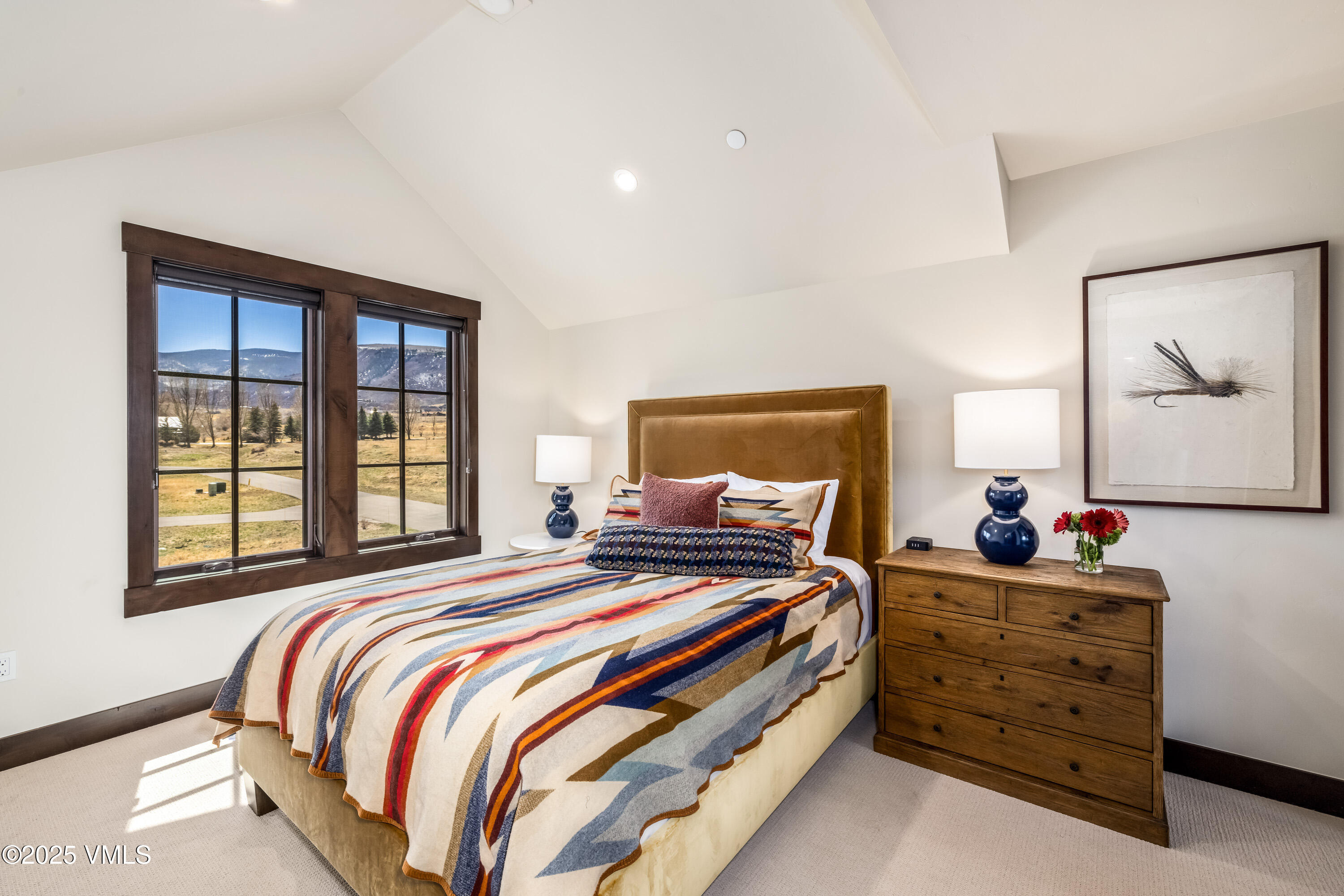 687 Hunters View Lane Eagle, CO 81631 - Photo 23 of 43 a bedroom with a bed and a window
