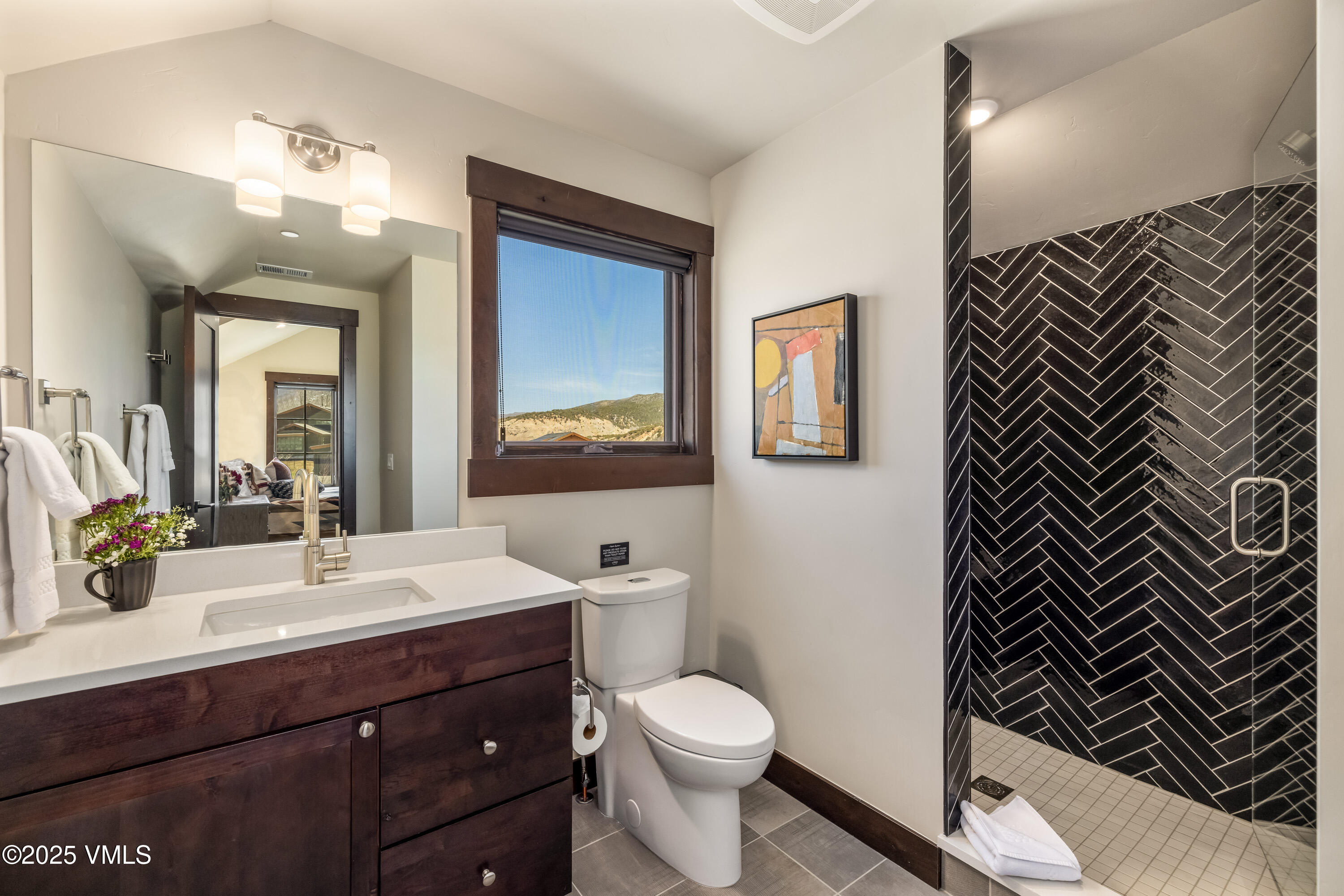 687 Hunters View Lane Eagle, CO 81631 - Photo 25 of 43 a bathroom with a sink and a mirror