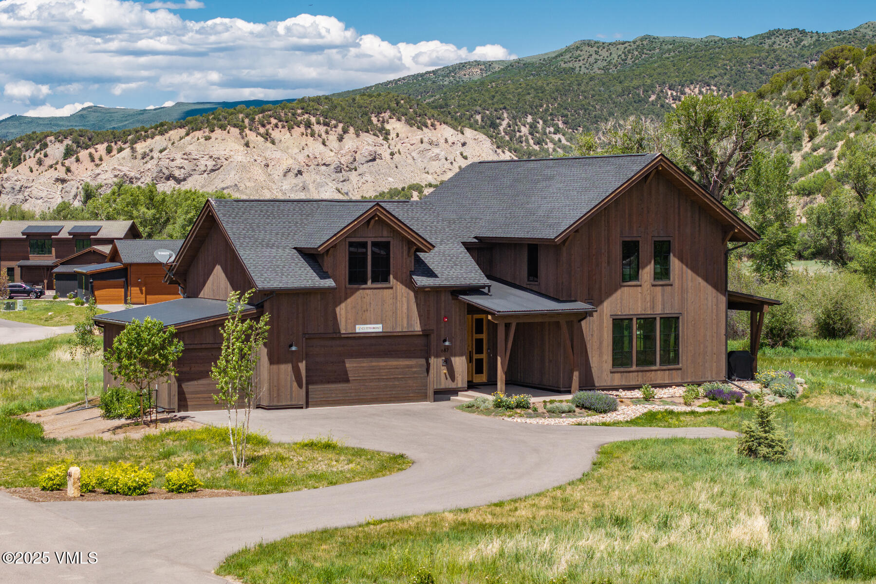687 Hunters View Lane Eagle, CO 81631 - Photo 33 of 43 a front view of a house with a yard