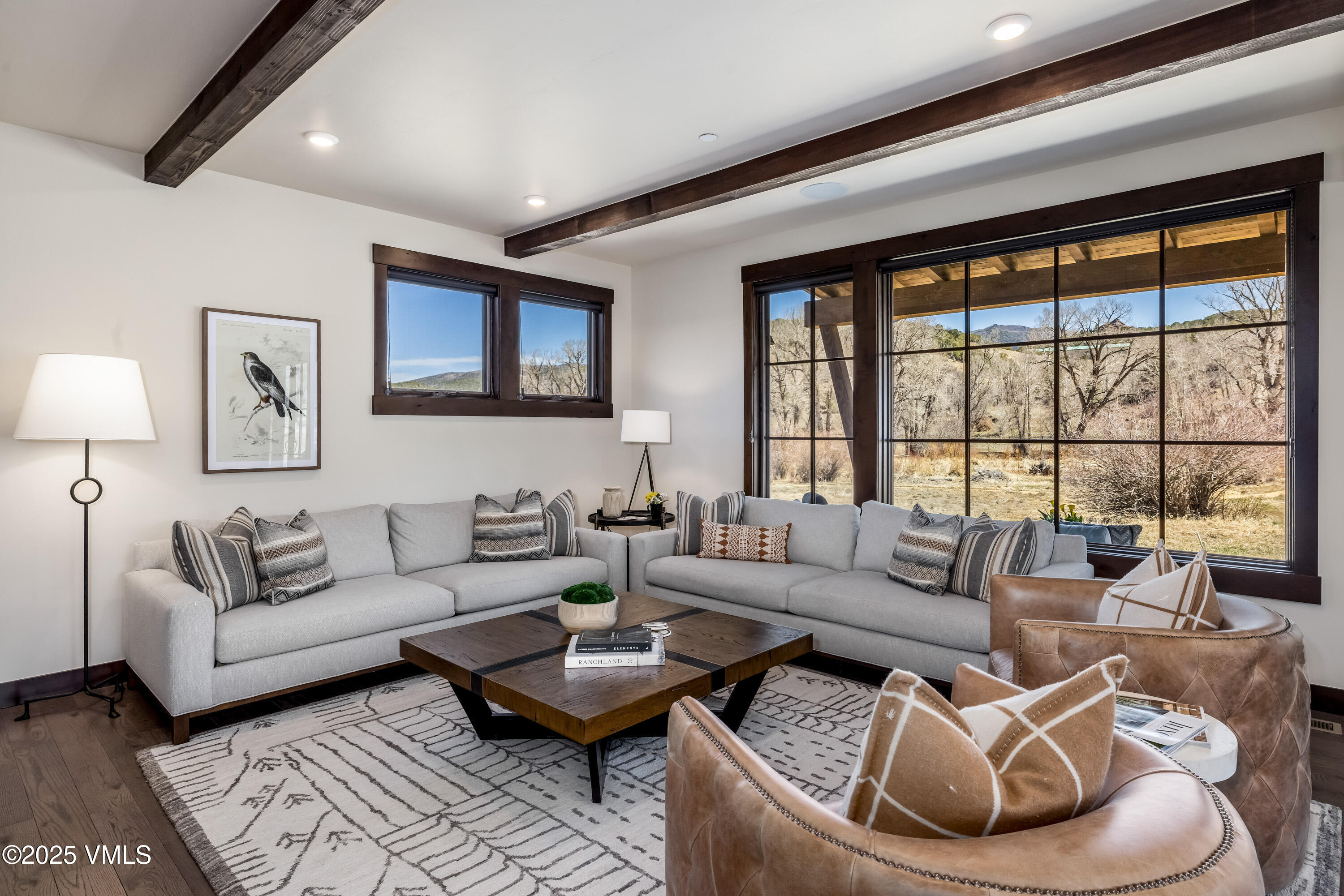 687 Hunters View Lane Eagle, CO 81631 - Photo 7 of 43 a living room with furniture and a large window