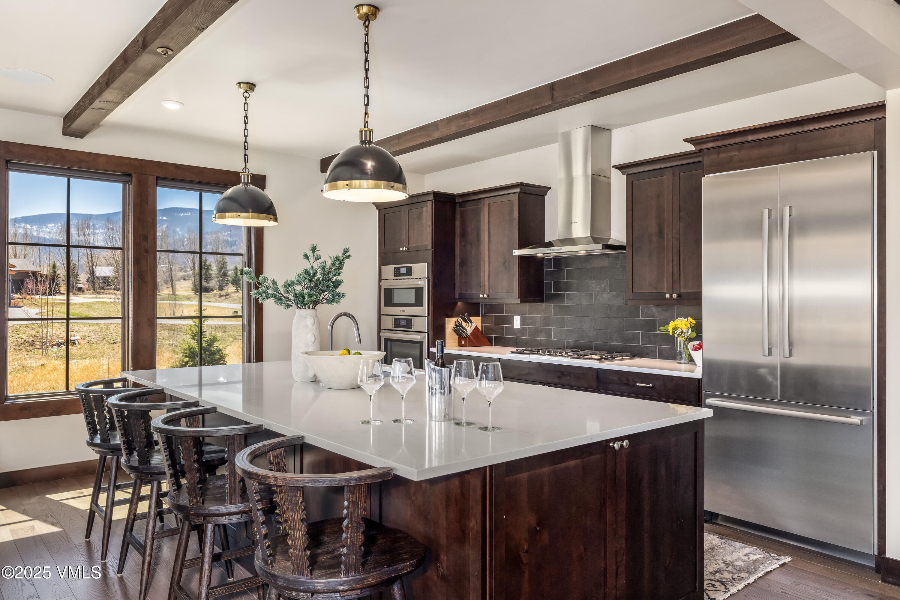 687 Hunters View Lane Eagle, CO 81631 - Photo 9 of 43 a kitchen with stainless steel appliances granite countertop a sink a stove and a refrigerator