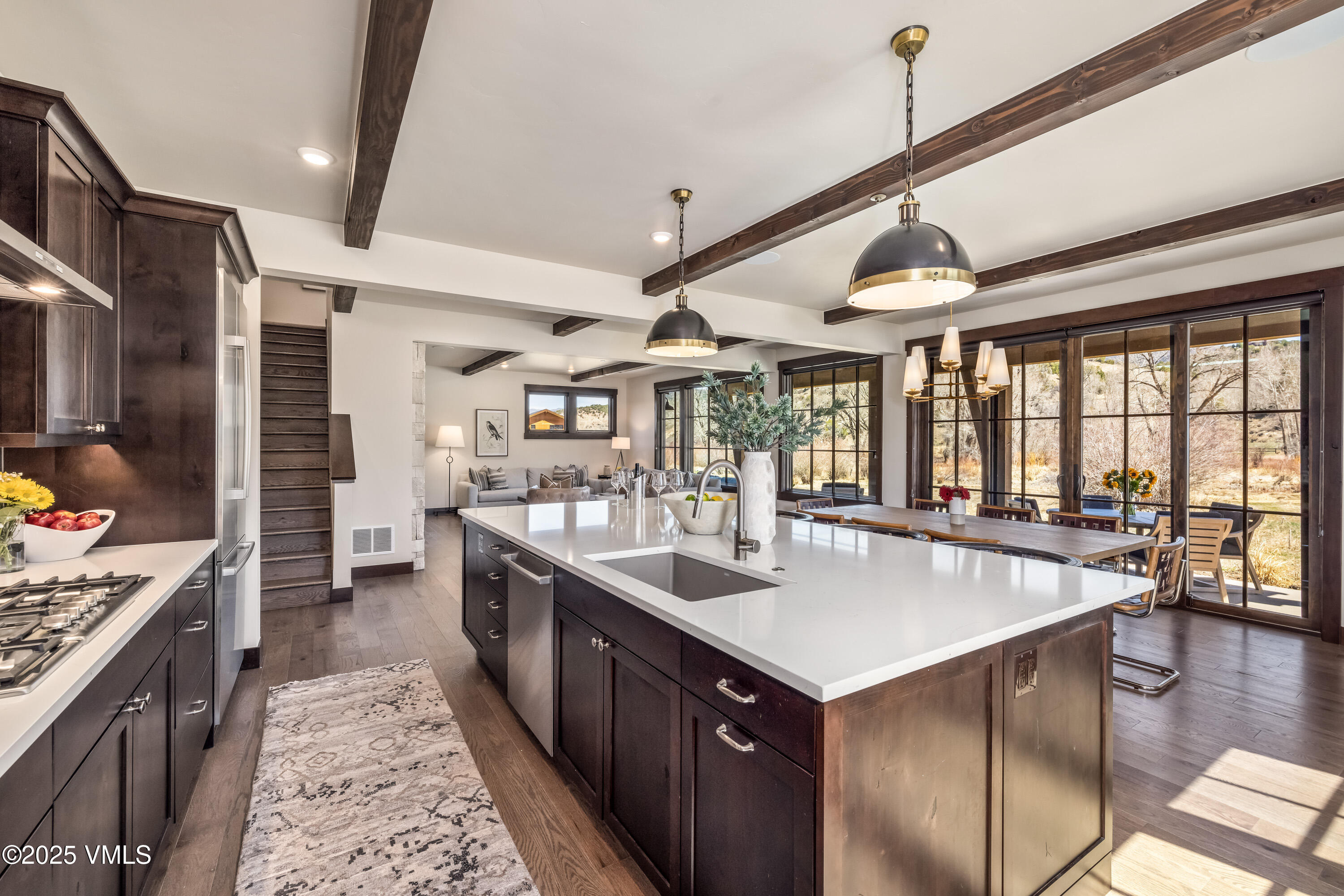 687 Hunters View Lane Eagle, CO 81631 - Photo 10 of 43 a large kitchen with kitchen island a large counter space