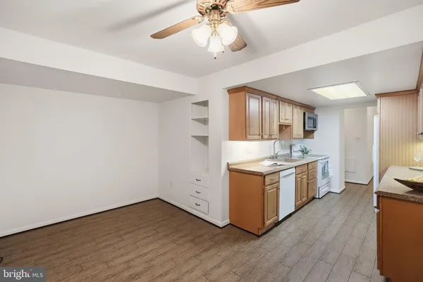 a kitchen with a stove refrigerator and cabinets