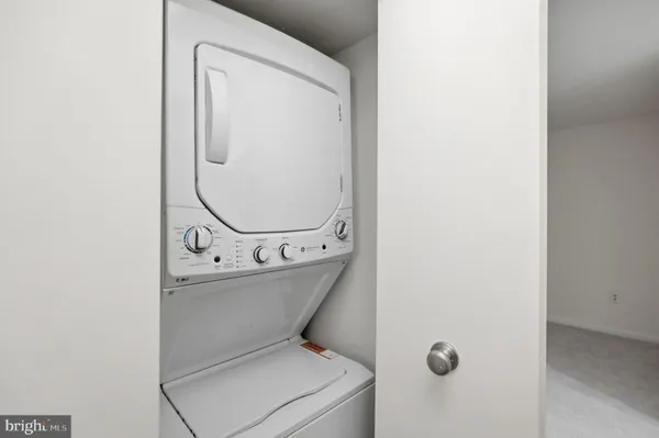 a view of entryway with kitchen