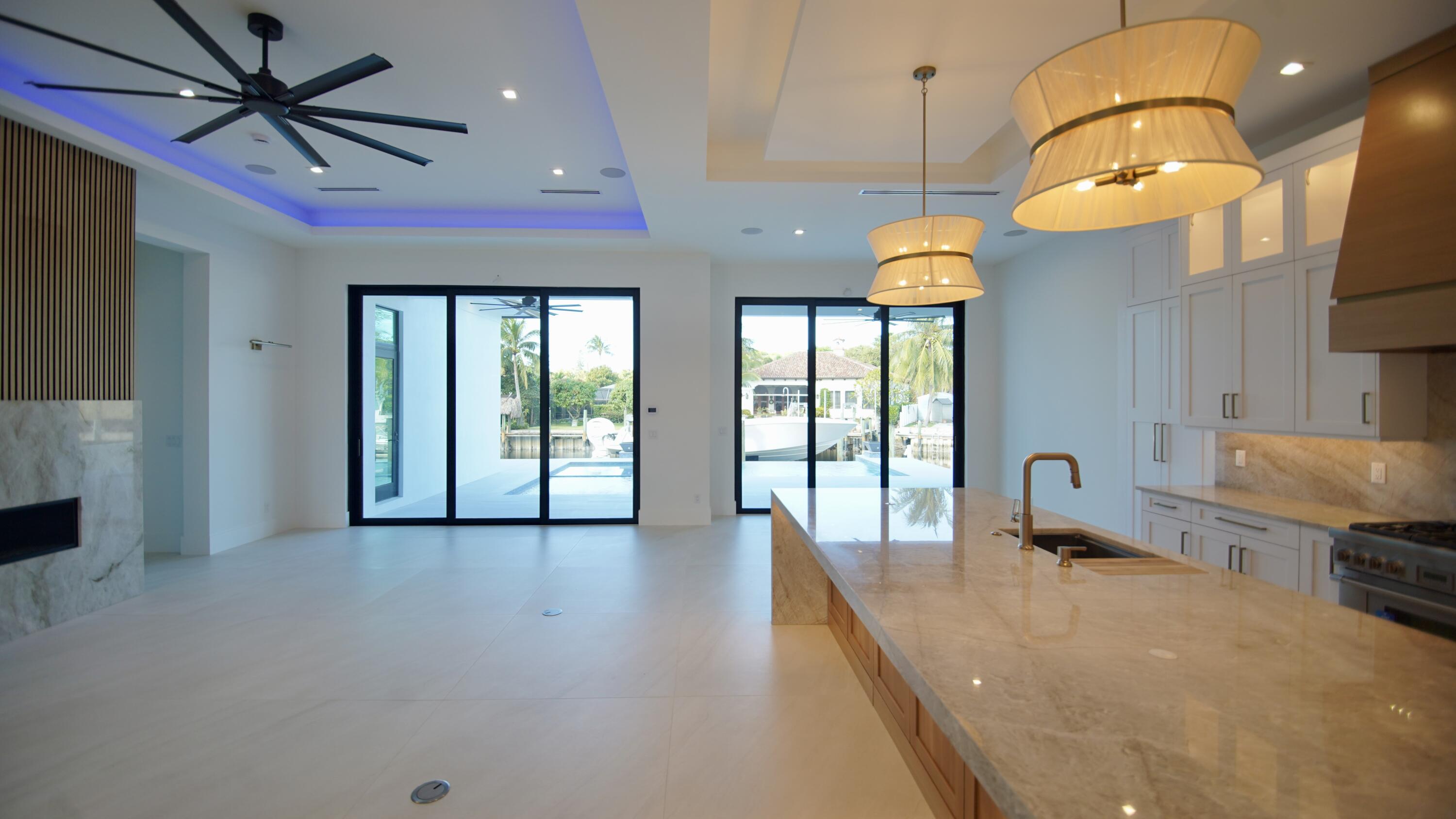 11331 Avery Road Palm Beach Gardens, FL 33410 - Photo 102 of 110 a very nice looking room with a large window and chandelier