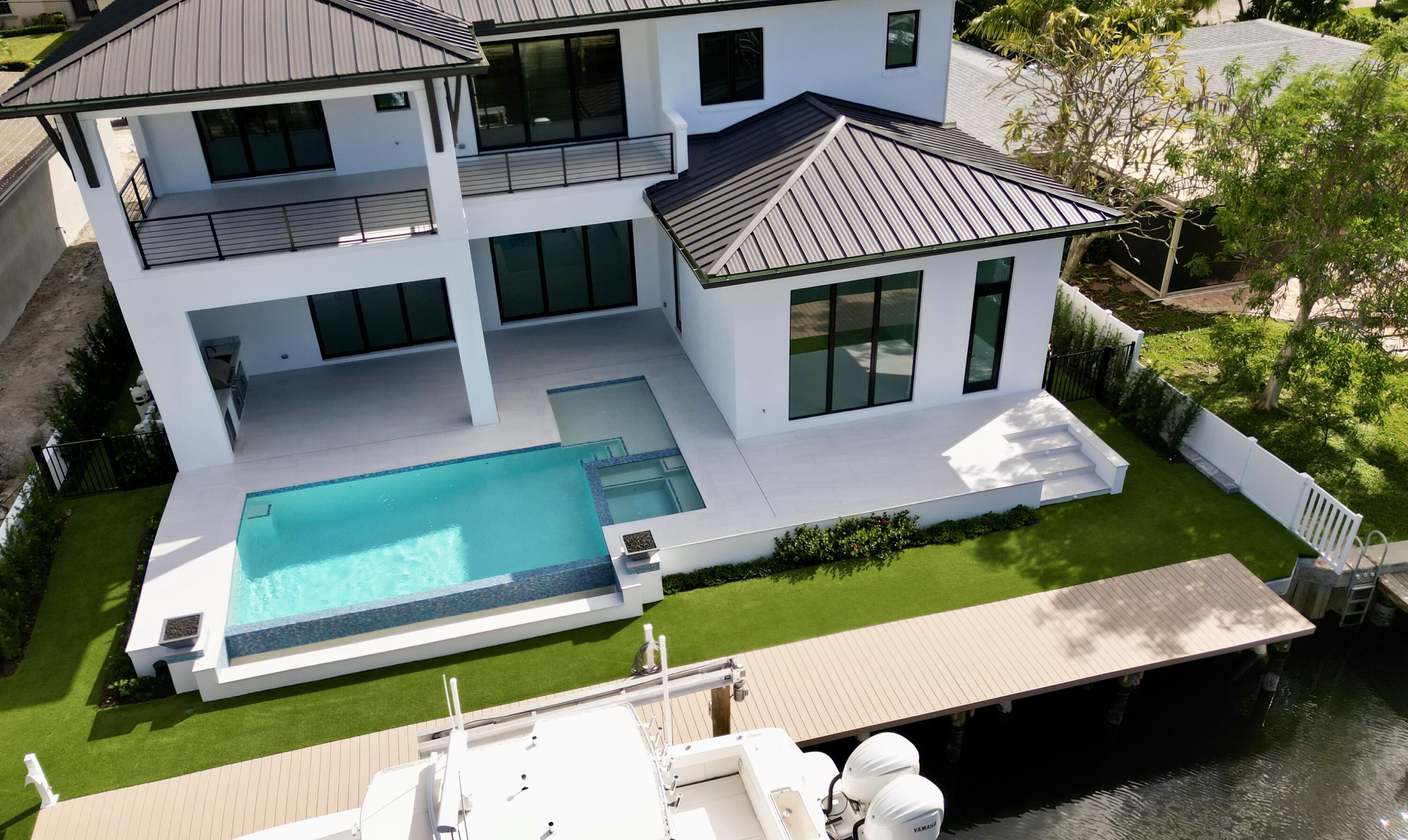 11331 Avery Road Palm Beach Gardens, FL 33410 - Photo 104 of 110 a front view of a house with a yard