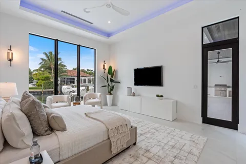 a view of a balcony with chairs and wooden floor